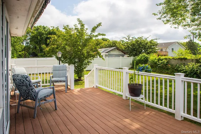 a view of a wooden deck with a bench