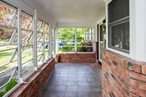 a view of a room with a large window