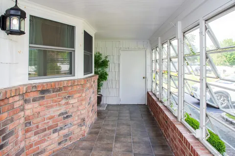 a view of a hallway with windows