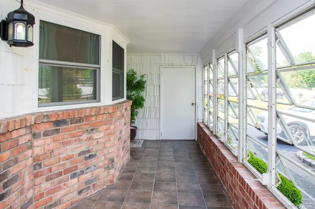 a view of a hallway with windows