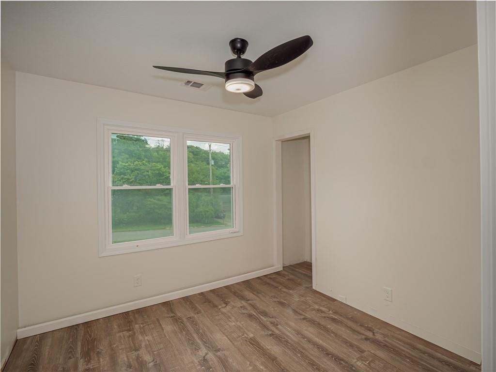 4505 Myrtle Hill Road Northeast Kennesaw, GA 30144 - Photo 18 of 27 a view of empty room with wooden floor and fan