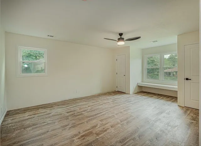 a view of an empty room with a window