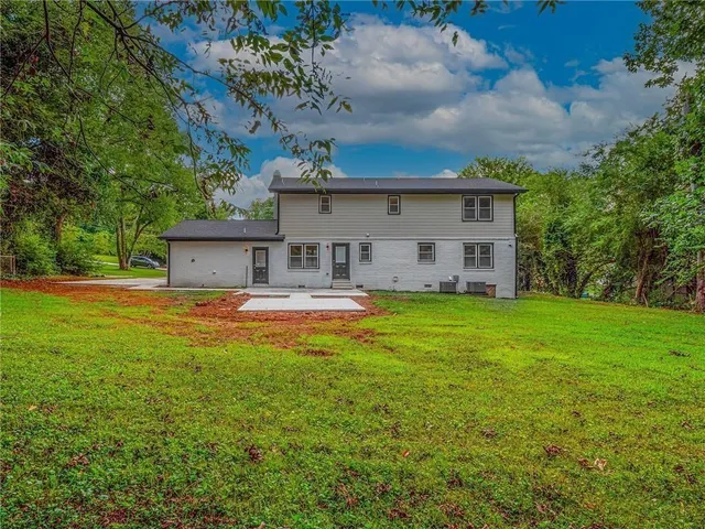 a view of a house with a big yard