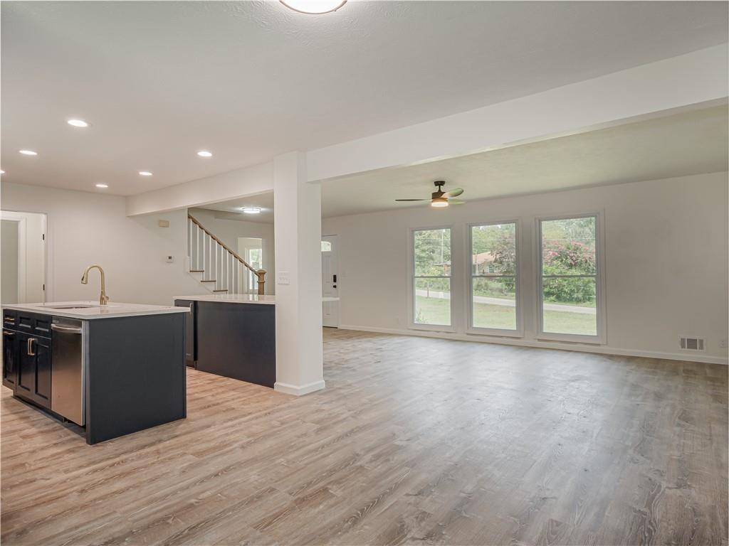 4505 Myrtle Hill Road Northeast Kennesaw, GA 30144 - Photo 4 of 27 a view of a kitchen with wooden floor and windows