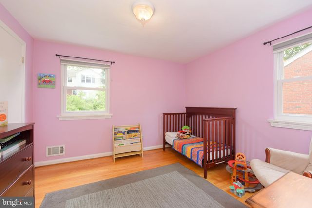 a bed room with a bed and a window