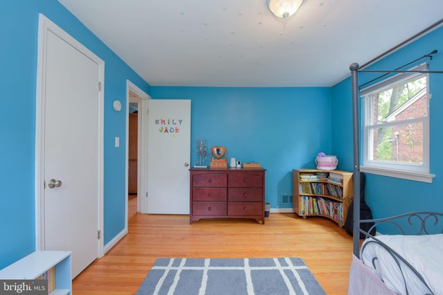 a bed room with furniture and a window