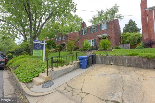 a view of a chair and table in the garden