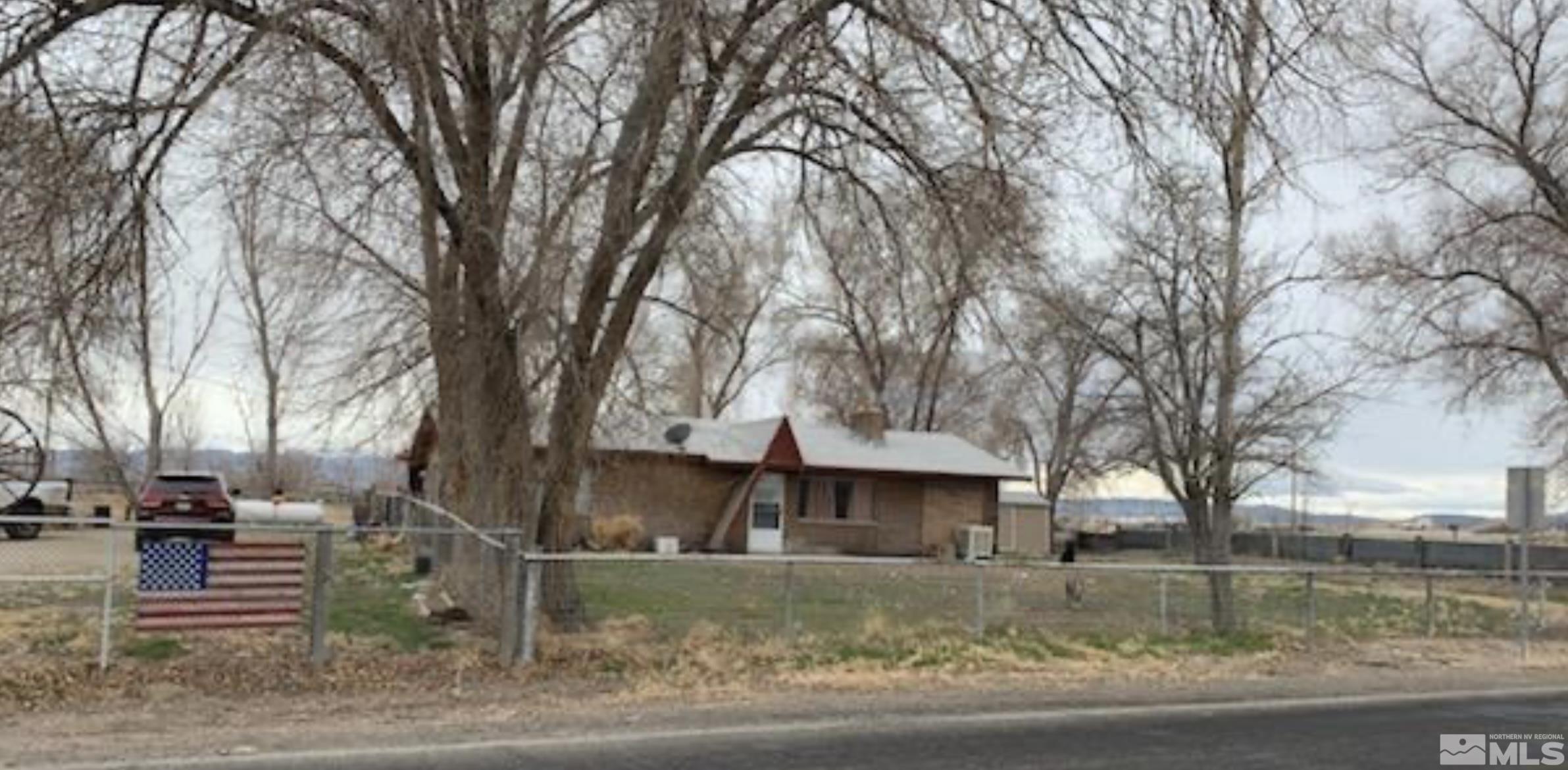 2975 Lone Tree Road Fallon, NV 89406 - Photo 1 of 26 a front view of a house with a yard