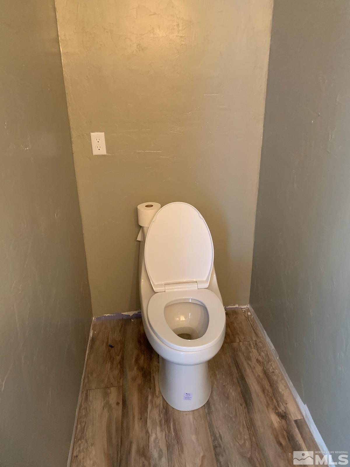 2975 Lone Tree Road Fallon, NV 89406 - Photo 15 of 26 a white toilet sitting in a bathroom
