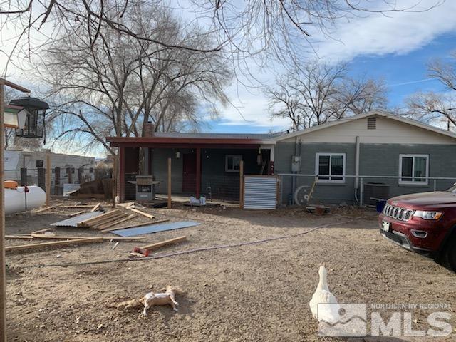 2975 Lone Tree Road Fallon, NV 89406 - Photo 2 of 26 a front view of a house with garden