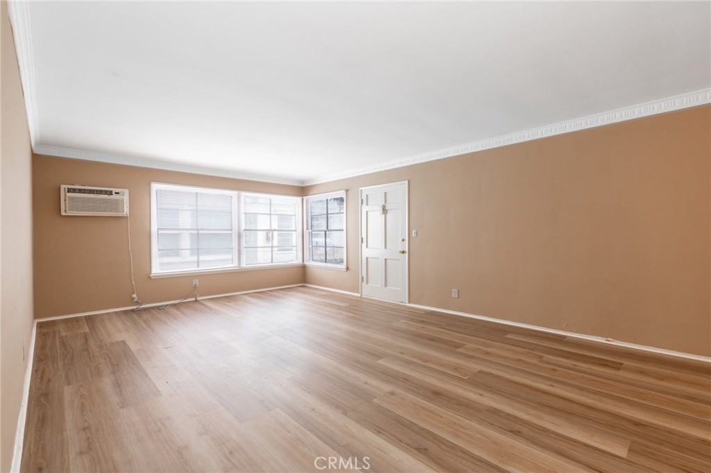 5319 Whitsett Avenue, Unit 3 Valley Village, CA 91607 - Photo 2 of 11 a view of an empty room with wooden floor and a window