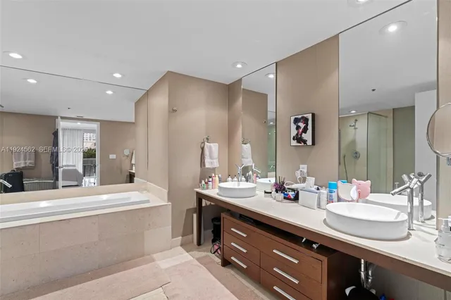 a bathroom with a sink double vanity and a mirror