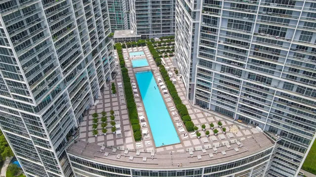 a view of a swimming pool with sitting space