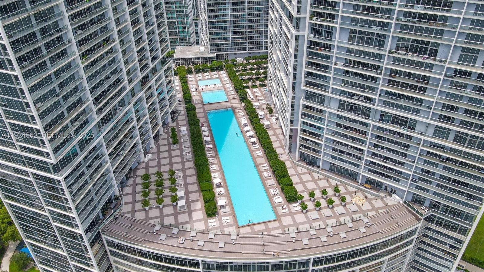495 Brickell Avenue, Unit 501 Miami, FL 33131 - Photo 28 of 34 a view of a swimming pool with sitting space
