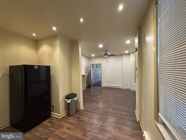 a view of a hallway with wooden shelves