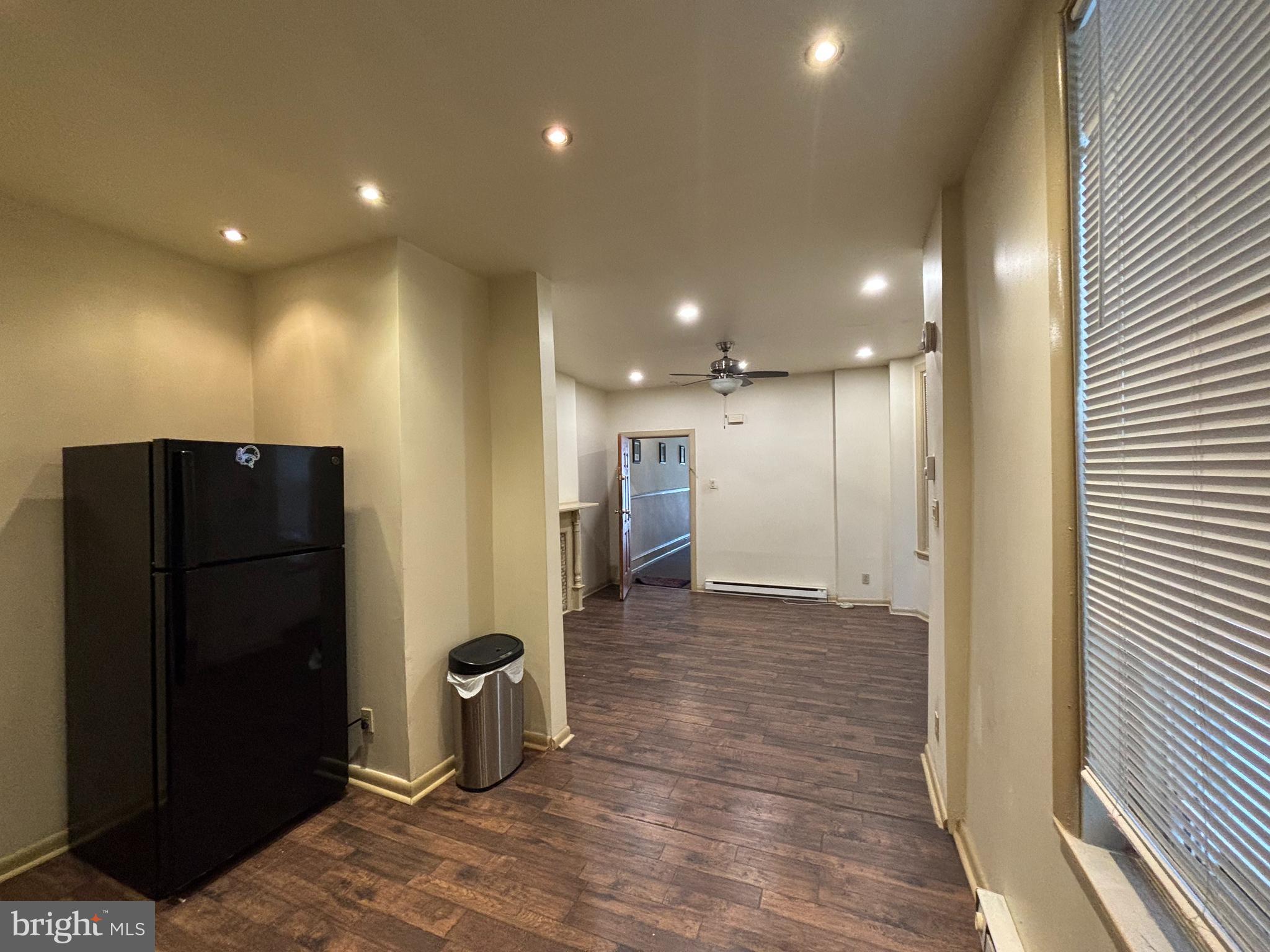 3734 North Sydenham Street, Unit 1 Philadelphia, PA 19140 - Photo 3 of 6 a view of a hallway with wooden shelves
