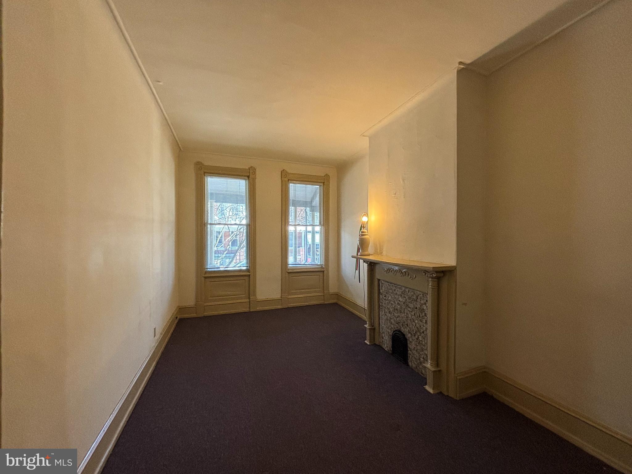 3734 North Sydenham Street, Unit 1 Philadelphia, PA 19140 - Photo 6 of 6 an empty room with windows