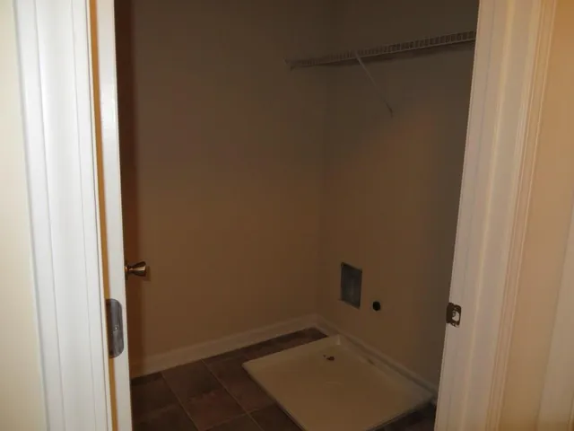 a view of a hallway with an empty room