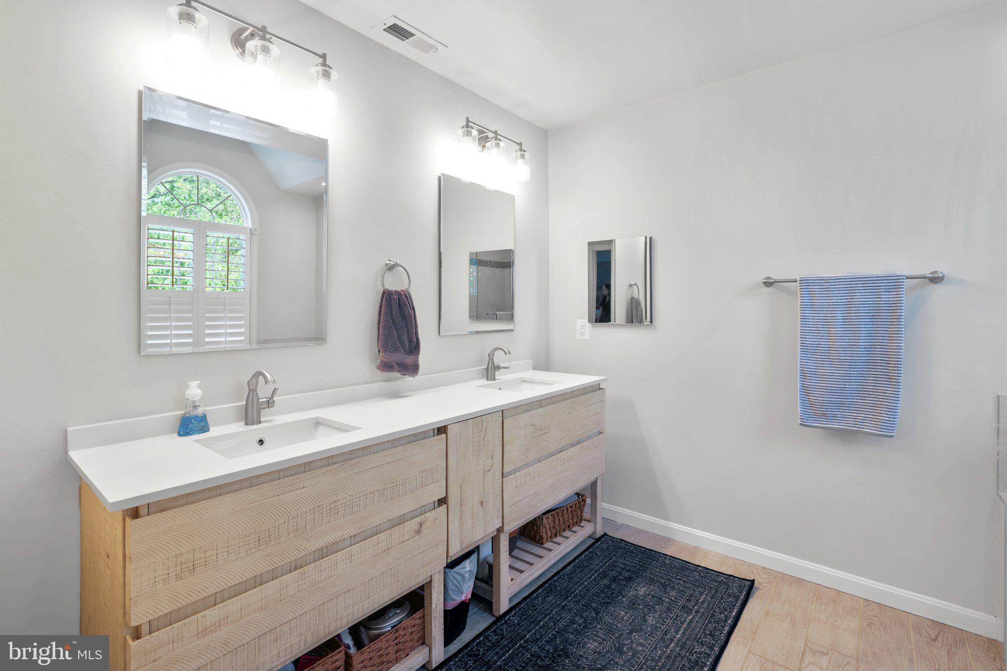 6732 Churchill Road McLean, VA 22101 - Photo 34 of 61 Modern elegance in a serene bathroom.