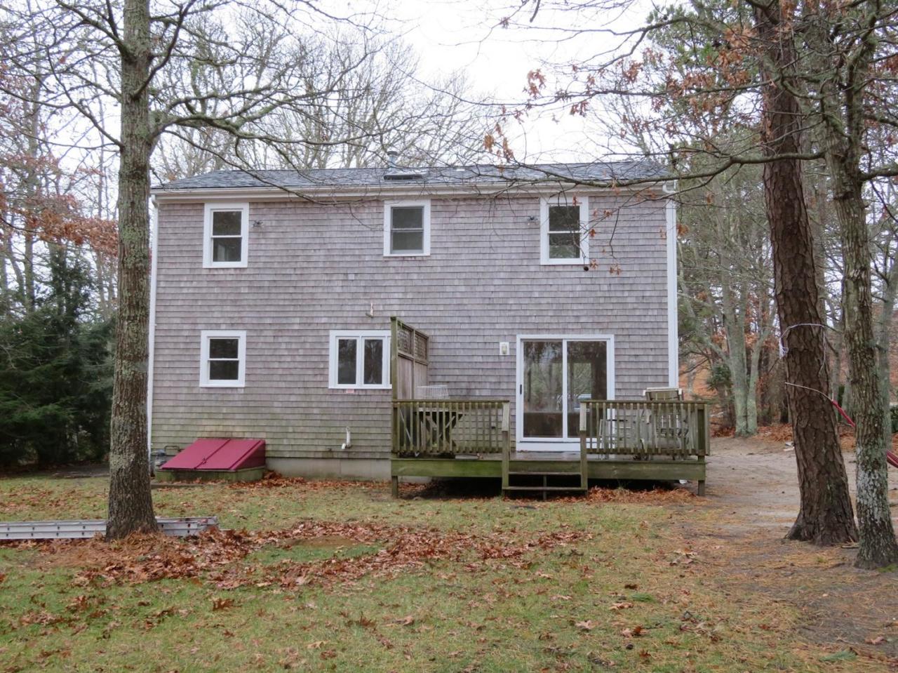 285 Shootflying Hill Road Centerville, MA 02632 - Photo 3 of 25 a front view of a house with yard