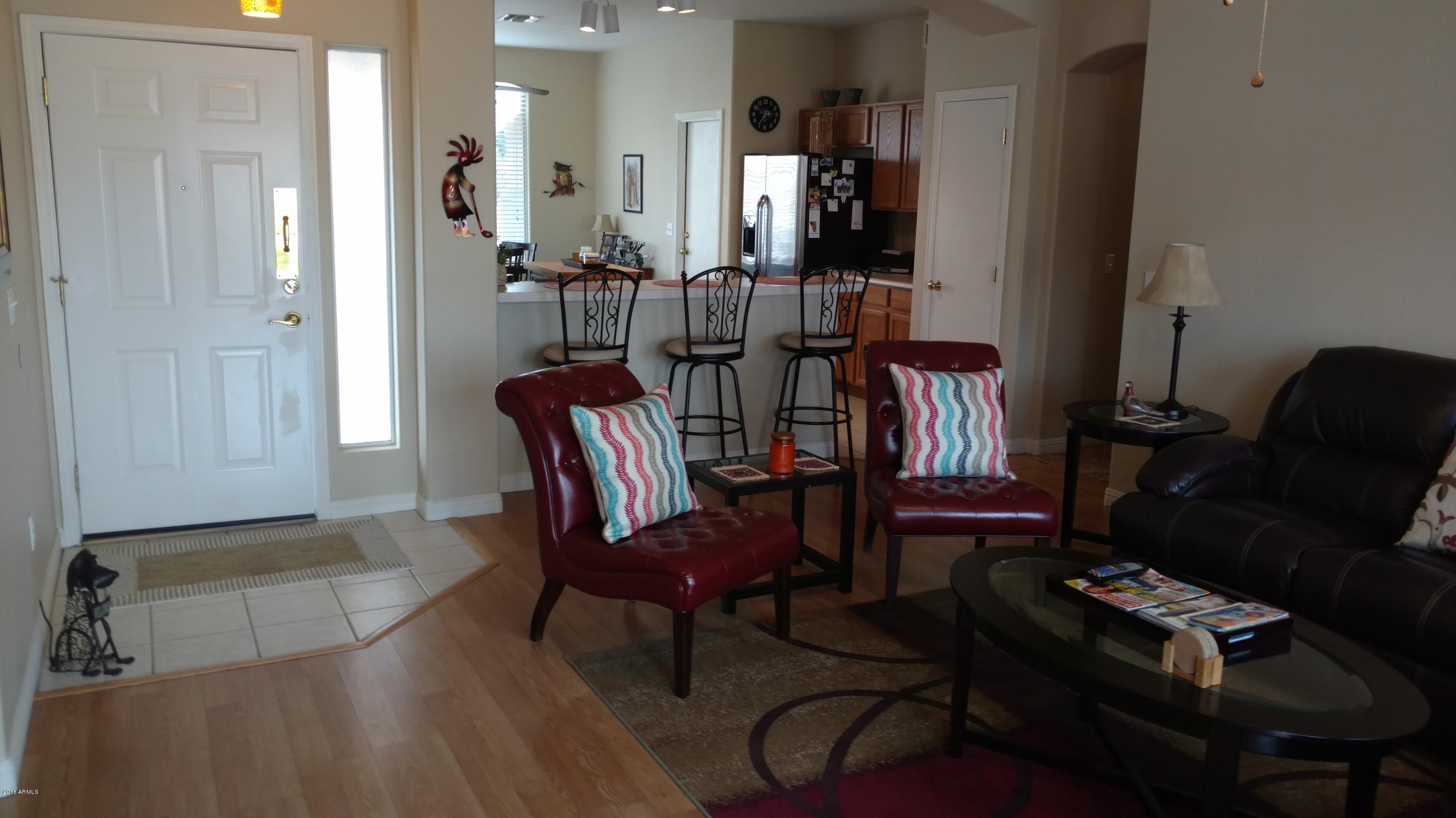 44 West Del Rio Street Gilbert, AZ 85233 - Photo 6 of 21 a view of a livingroom with furniture and a window