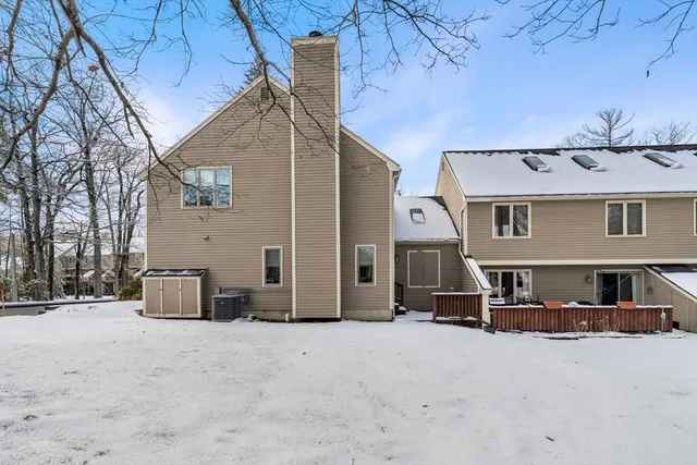 a view of a house with a snow in the yard