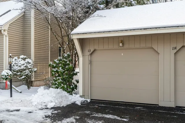 a view of a white house with a yard