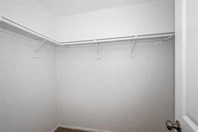 a view of a room with shelf on the wall