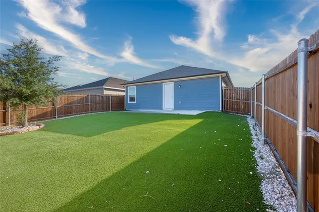 a view of a backyard with a garden