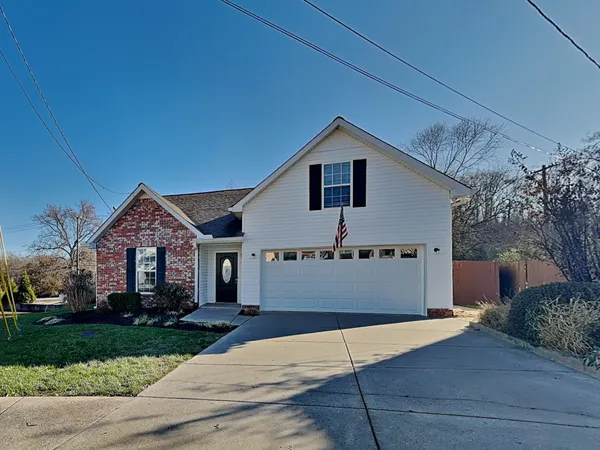 a front view of a house with yard