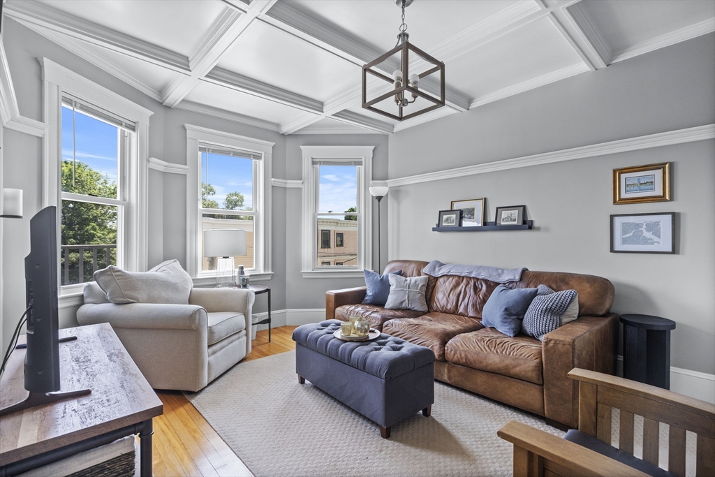 40 King Street, Unit 3 Boston, MA 02122 - Photo 1 of 14 a living room with furniture ceiling fan and a window