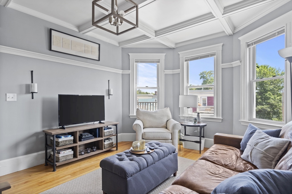 40 King Street, Unit 3 Boston, MA 02122 - Photo 11 of 14 a living room with furniture and a flat screen tv