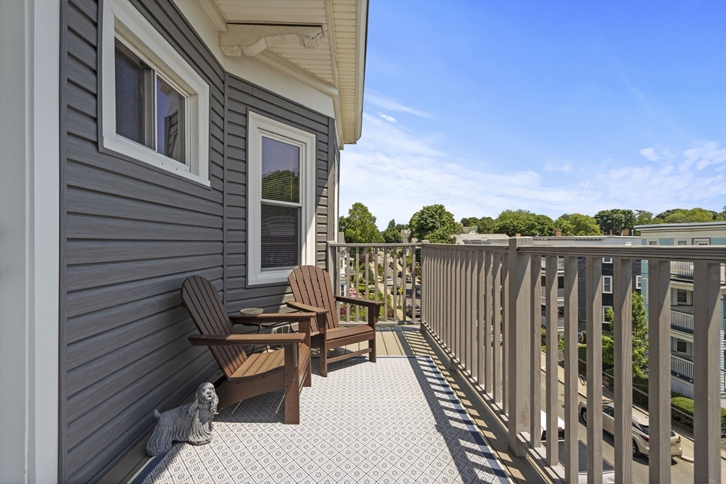 40 King Street, Unit 3 Boston, MA 02122 - Photo 12 of 14 a view of balcony with wooden floor and seating space