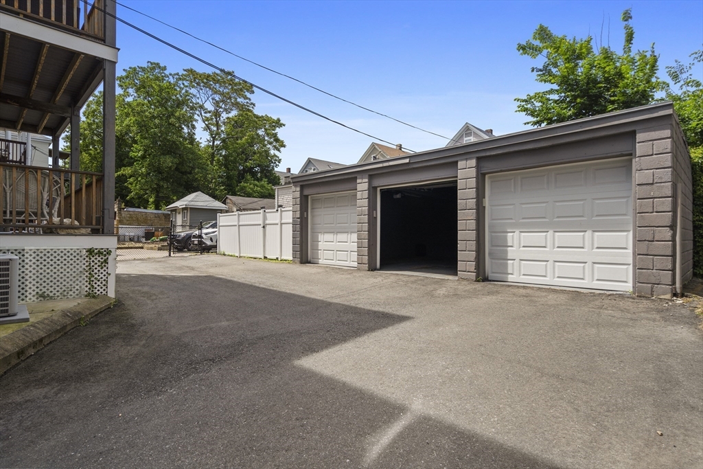 40 King Street, Unit 3 Boston, MA 02122 - Photo 13 of 14 a view of a house with a garage
