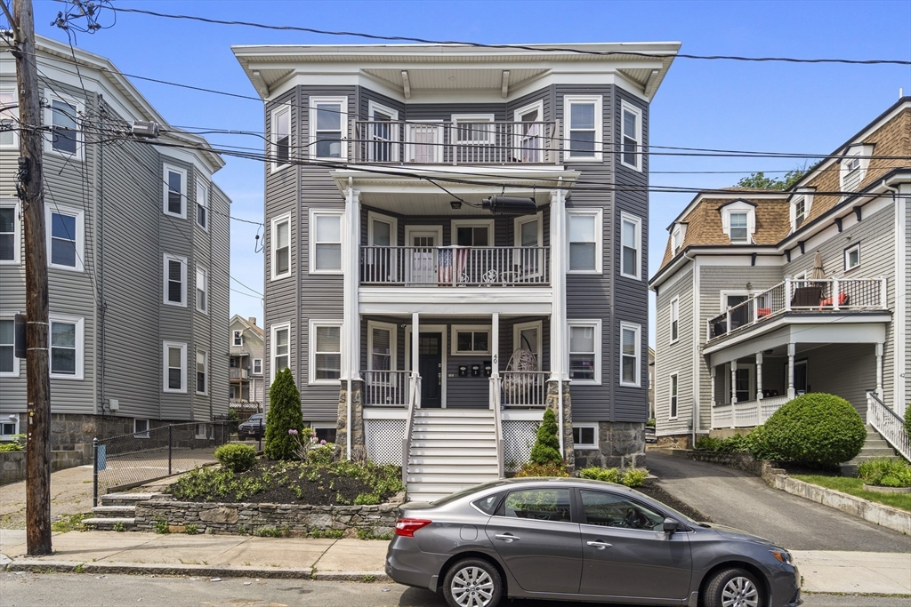 40 King Street, Unit 3 Boston, MA 02122 - Photo 14 of 14 a front view of a residential apartment building with a yard