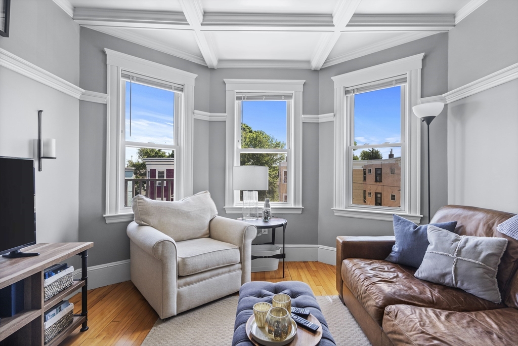 40 King Street, Unit 3 Boston, MA 02122 - Photo 2 of 14 a living room with furniture and a flat screen tv