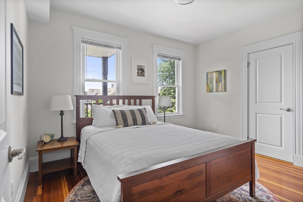 40 King Street, Unit 3 Boston, MA 02122 - Photo 6 of 14 a bedroom with a bed and a table