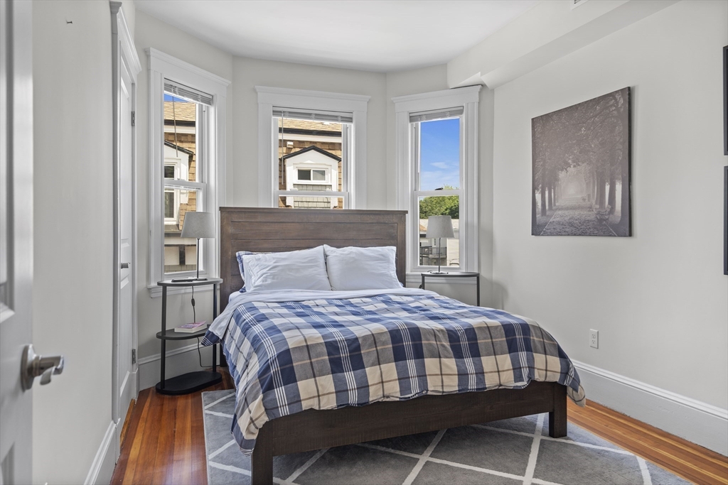 40 King Street, Unit 3 Boston, MA 02122 - Photo 7 of 14 a bedroom with a bed and a window