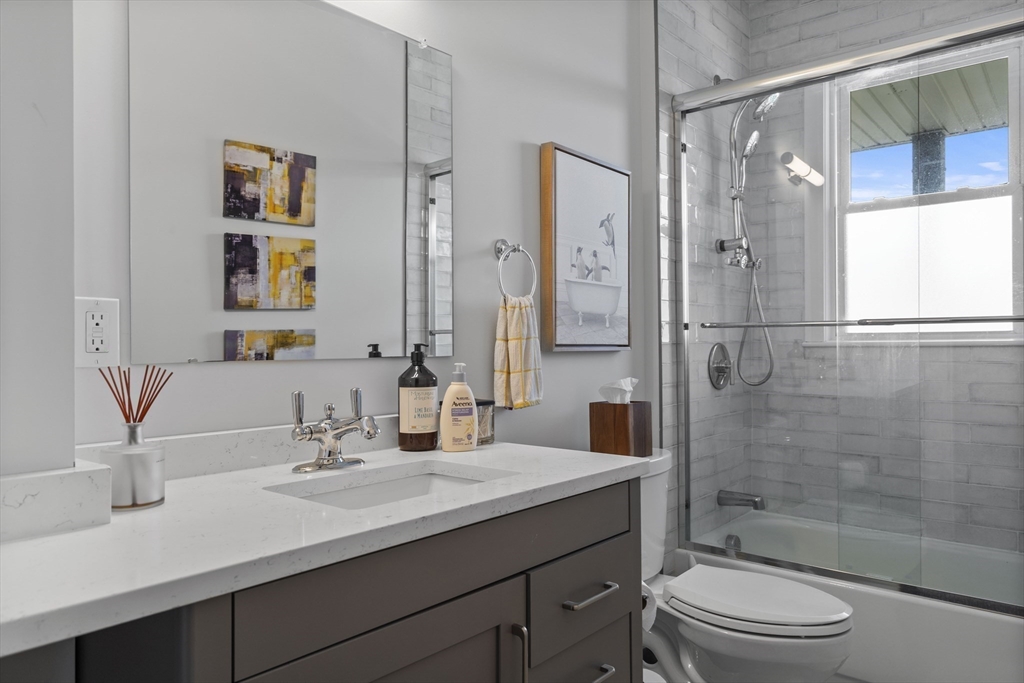 40 King Street, Unit 3 Boston, MA 02122 - Photo 9 of 14 a bathroom with a sink a toilet and shower