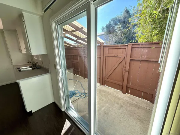 a view of walk in closet with wooden floor