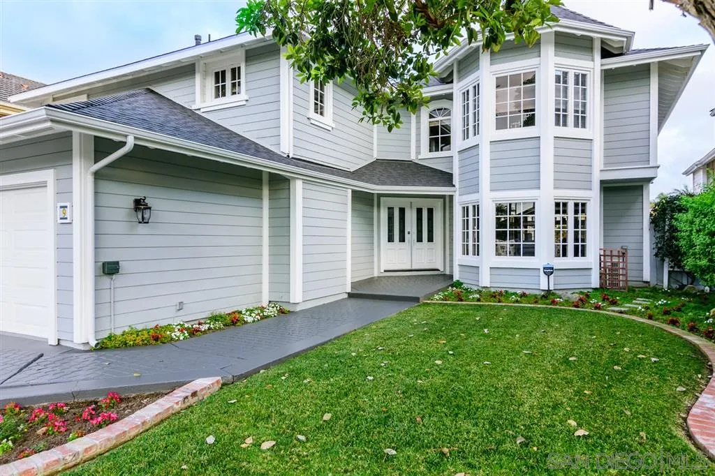 9 Buccaneer Way Coronado, CA 92118 - Photo 1 of 23 a front view of a house with a garden and yard