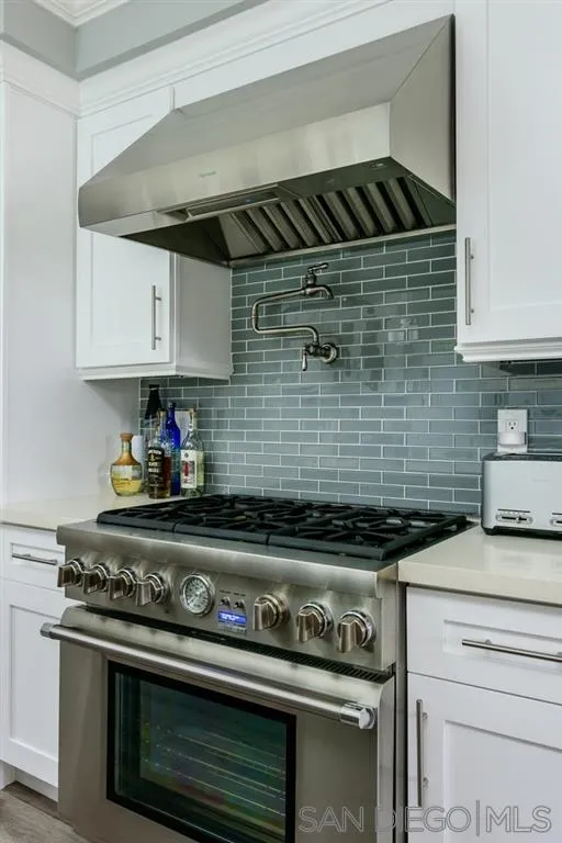 9 Buccaneer Way Coronado, CA 92118 - Photo 11 of 23 a kitchen with a stove and cabinets