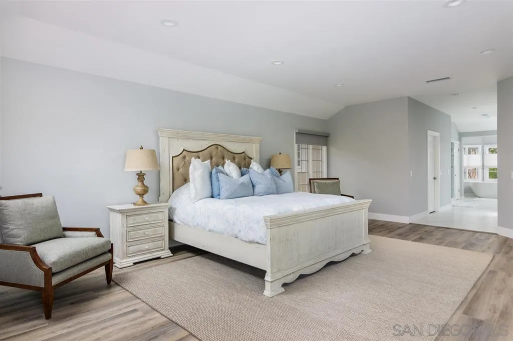 9 Buccaneer Way Coronado, CA 92118 - Photo 15 of 23 a spacious bedroom with a bed and wooden floor
