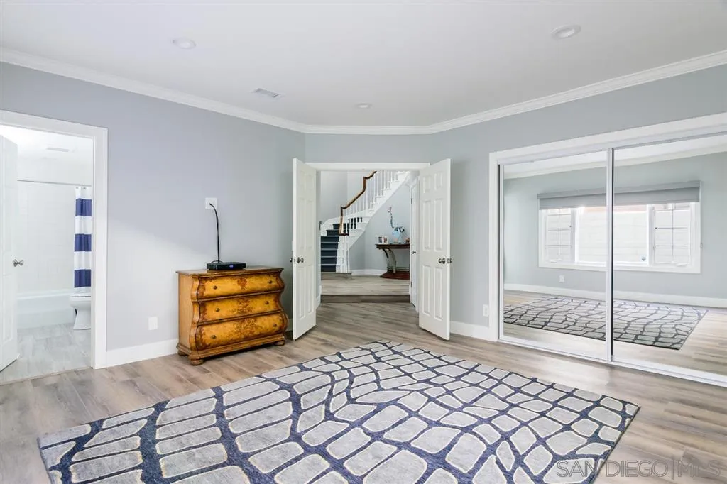 9 Buccaneer Way Coronado, CA 92118 - Photo 17 of 23 a bedroom with a bed and a cabinets