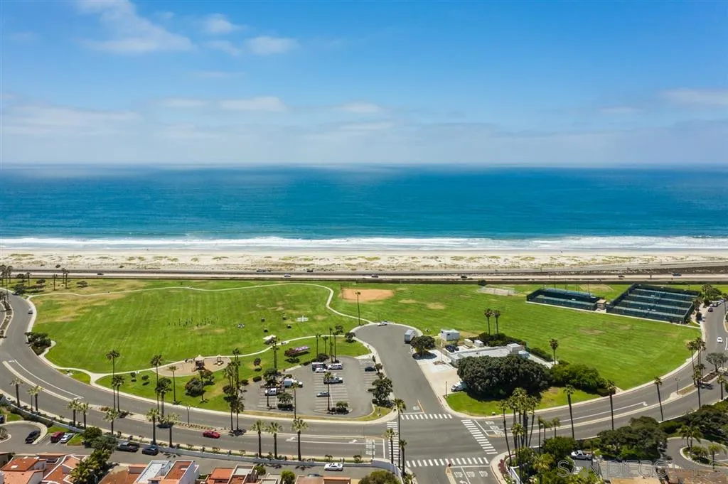 9 Buccaneer Way Coronado, CA 92118 - Photo 22 of 23 a view of a swimming pool with a garden