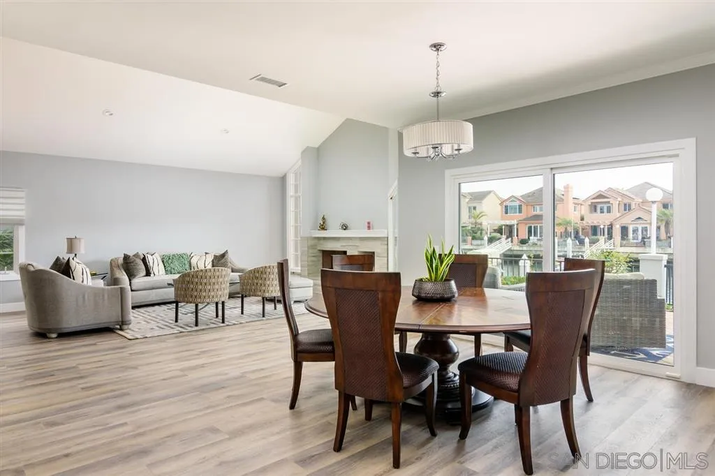 9 Buccaneer Way Coronado, CA 92118 - Photo 7 of 23 a view of a dining room with furniture window and wooden floor
