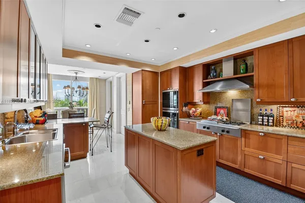 a view of walk in closet with clothes