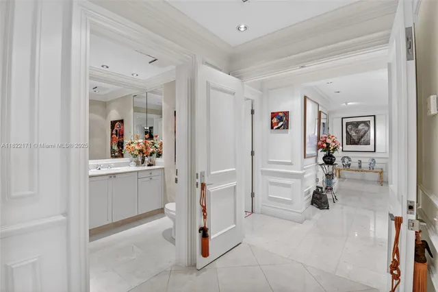 a view of a dining room with a table and chairs