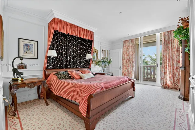 a dining room with furniture a chandelier and wooden floor