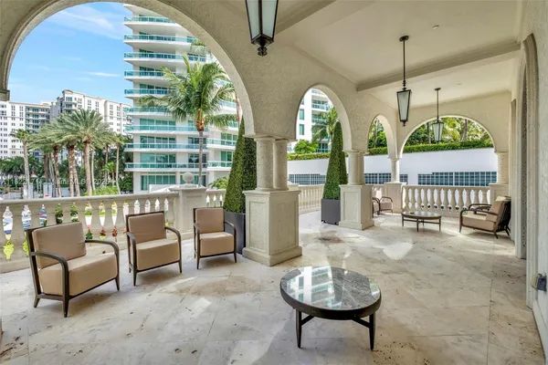 an aerial view of a house with swimming pool and patio